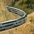 McKinley Explorer dome cars rounding a corner.  
